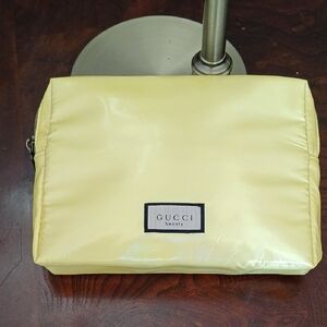 Gucci pale yellow glossy cosmetic pouch